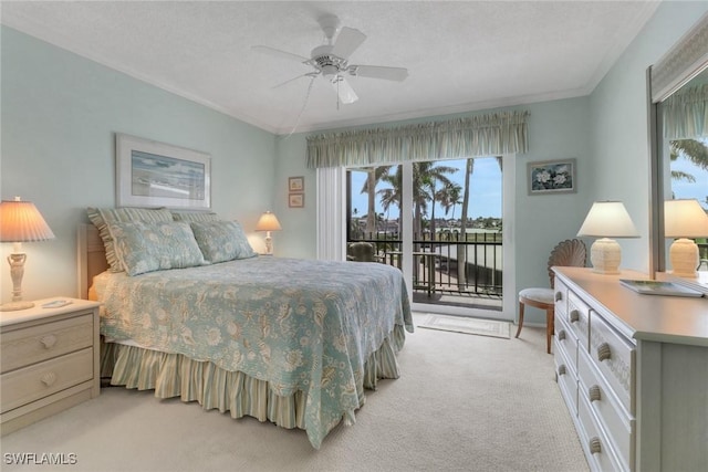 3399 Gulf Shore Blvd N Unit 303, Naples, FL 34103 - bedroom featuring multiple windows, access to exterior, light colored carpet, crown molding, and ceiling fan