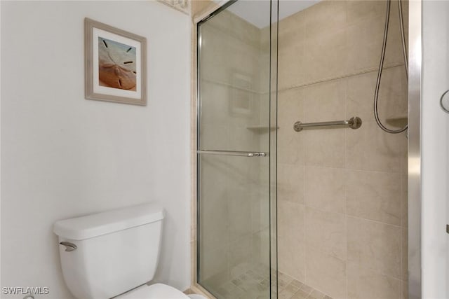 3399 Gulf Shore Blvd N Unit 303, Naples, FL 34103 - bathroom featuring a shower stall and toilet