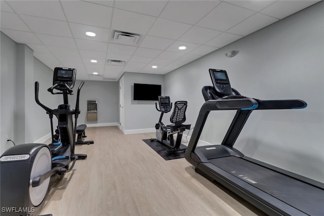 3399 Gulf Shore Blvd N Unit 303, Naples, FL 34103 - workout area featuring wood finished floors, baseboards, a paneled ceiling, and recessed lighting