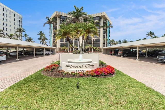 3399 Gulf Shore Blvd N Unit 303, Naples, FL 34103 - view of community featuring covered parking and a yard
