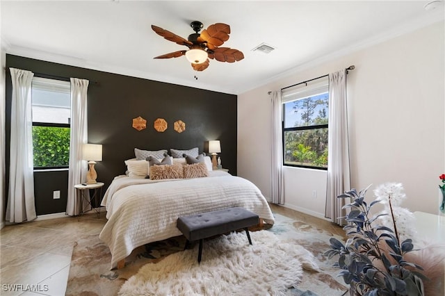 9519 Foxglove Ln, Naples, FL 34120 - bedroom featuring multiple windows, ornamental molding, baseboards, an accent wall, and ceiling fan