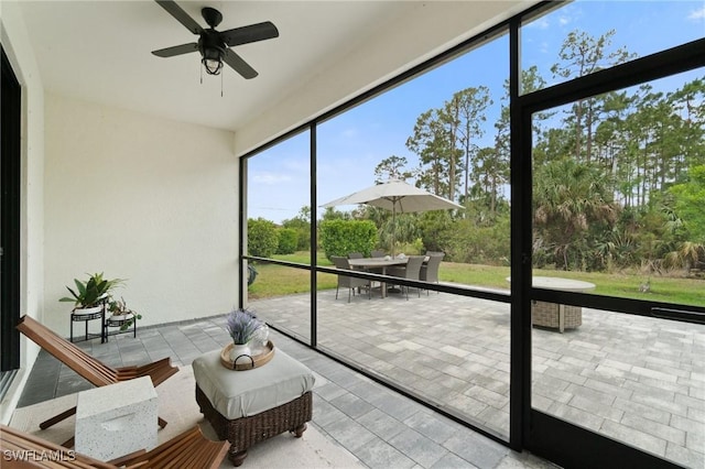 9519 Foxglove Ln, Naples, FL 34120 - sunroom / solarium featuring ceiling fan and outdoor dining space