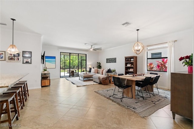 9519 Foxglove Ln, Naples, FL 34120 - dining room with crown molding, ceiling fan, light tile patterned flooring, baseboards, and a chandelier