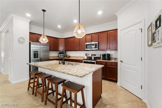 9519 Foxglove Ln, Naples, FL 34120 - kitchen with stainless steel appliances, a sink, a kitchen bar, ornamental molding, and hanging light fixtures