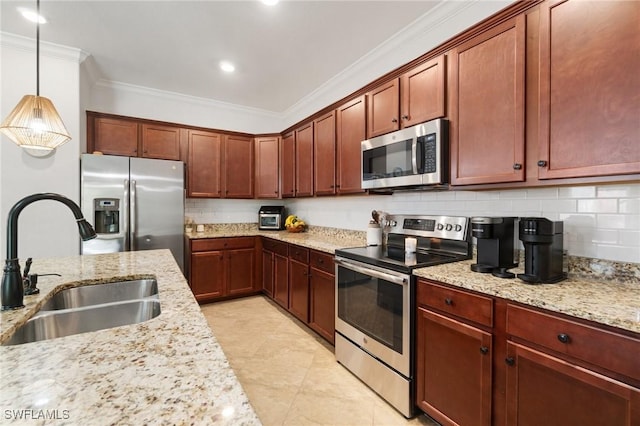 9519 Foxglove Ln, Naples, FL 34120 - kitchen featuring appliances with stainless steel finishes, a sink, crown molding, light stone counters, and backsplash