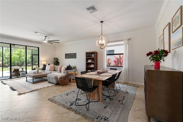 9519 Foxglove Ln, Naples, FL 34120 - dining room featuring light tile patterned floors, crown molding, a ceiling fan, and a chandelier