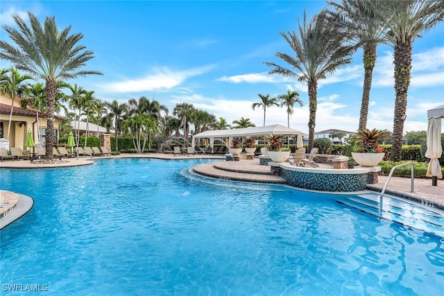 9519 Foxglove Ln, Naples, FL 34120 - community pool with a patio