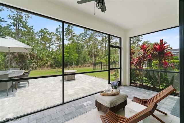 9519 Foxglove Ln, Naples, FL 34120 - sunroom / solarium featuring a ceiling fan and outdoor dining area