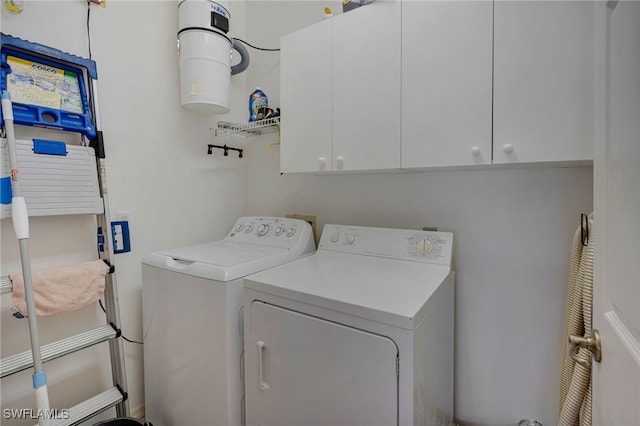 25224 Pelican Creek Cir Unit 203, Bonita Springs, FL 34134 - laundry room featuring cabinet space and washing machine and clothes dryer