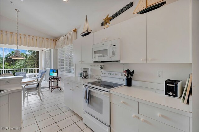 25224 Pelican Creek Cir Unit 203, Bonita Springs, FL 34134 - kitchen featuring white appliances, lofted ceiling, light tile patterned floors, light countertops, and white cabinetry