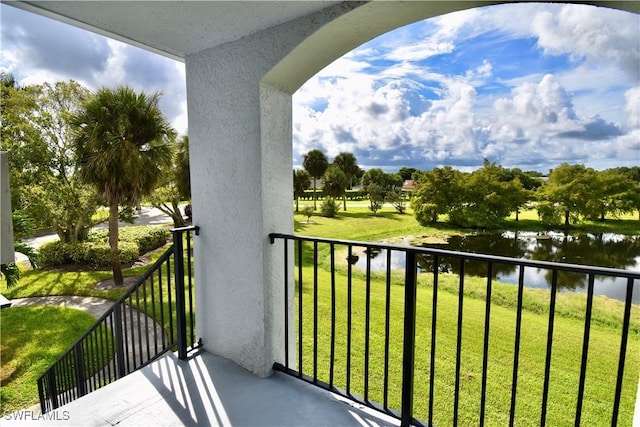 balcony featuring a water view