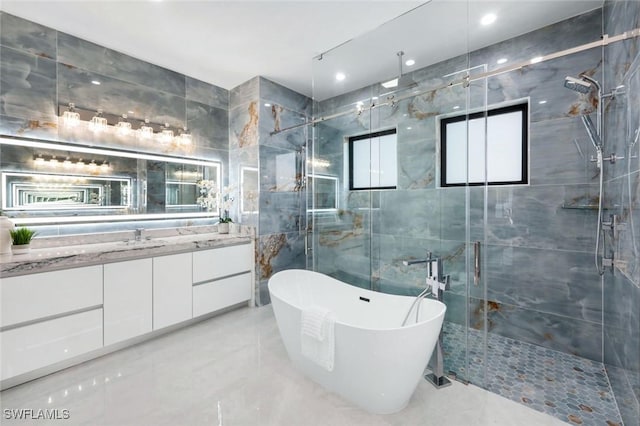 333 12th Ave NE, Naples, FL 34120 - bathroom featuring a marble finish shower, a freestanding bath, vanity, marble tiled floors, and tile walls