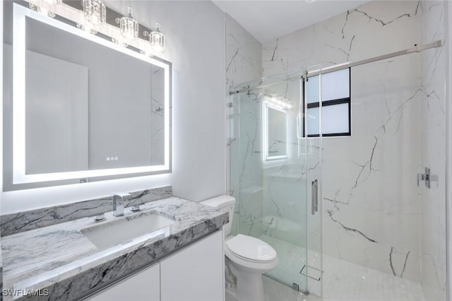 333 12th Ave NE, Naples, FL 34120 - full bath featuring vanity, toilet, and a marble finish shower