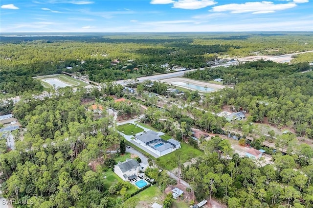 333 12th Ave NE, Naples, FL 34120 - aerial view of property and surrounding area with a forest