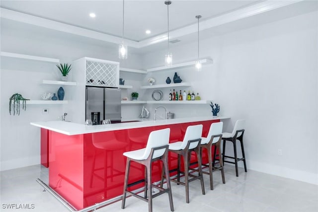 333 12th Ave NE, Naples, FL 34120 - indoor wet bar with stainless steel refrigerator with ice dispenser, decorative light fixtures, baseboards, and recessed lighting