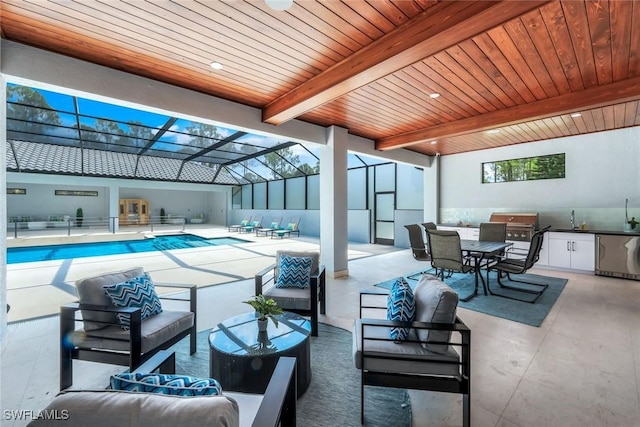 333 12th Ave NE, Naples, FL 34120 - swimming pool featuring outdoor lounge area, a patio, outdoor dining area, and exterior kitchen