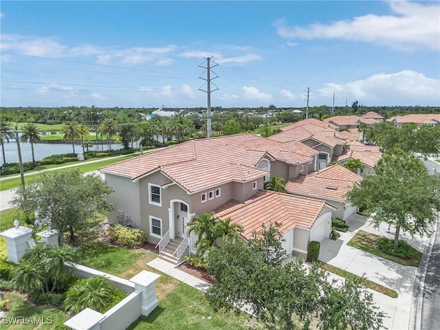 aerial perspective of suburban area featuring a nearby body of water