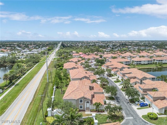 aerial view of residential area with a large body of water