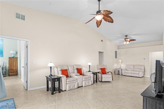 living area with ceiling fan, light tile patterned floors, high vaulted ceiling, and baseboards