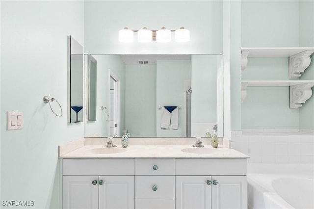 bathroom with a bath and double vanity