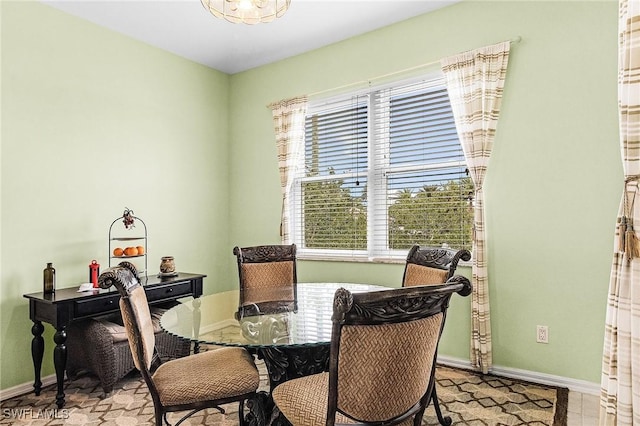 dining space featuring baseboards