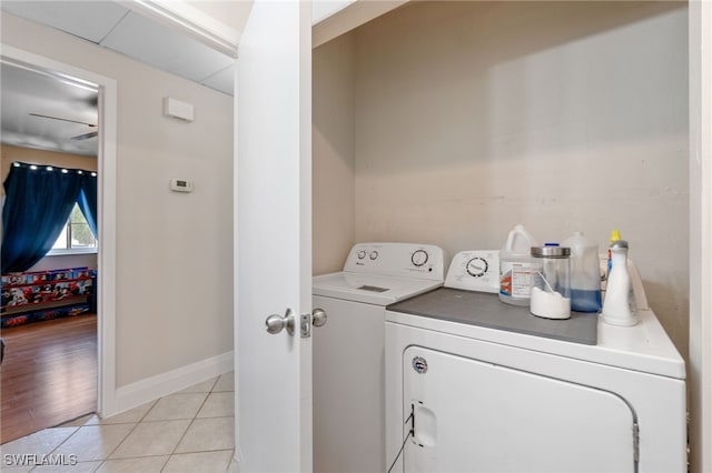3321 Golden Gate Blvd E, Naples, FL 34120 - laundry area with washer and dryer, light tile patterned floors, and baseboards