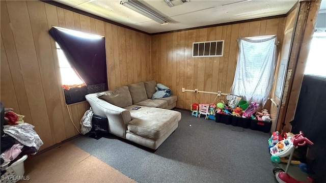 17200 Kentara Way, Fort Myers, FL 33913 - sitting room with wood walls, carpet floors, and plenty of natural light