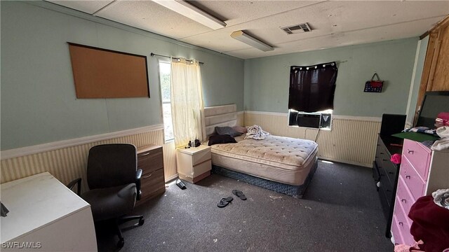 17200 Kentara Way, Fort Myers, FL 33913 - bedroom with wainscoting, an office area, cooling unit, and carpet floors
