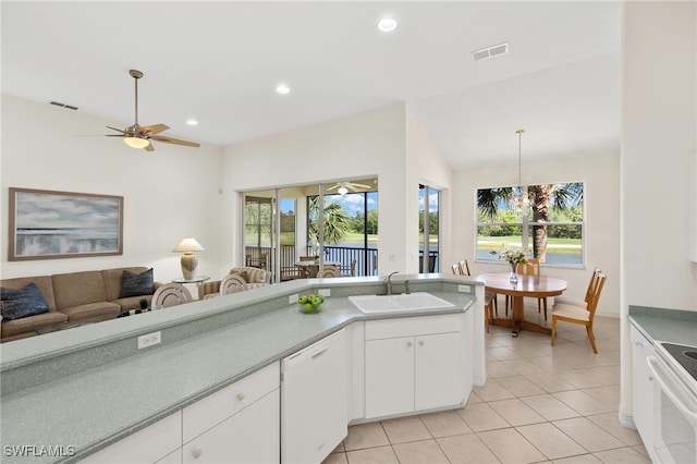 21551 Pelican Sound Dr Unit 202, Estero, FL 33928 - kitchen featuring white appliances, open floor plan, a sink, light tile patterned flooring, and a ceiling fan