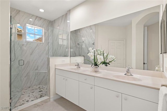 21551 Pelican Sound Dr Unit 202, Estero, FL 33928 - bathroom featuring a marble finish shower, double vanity, marble finish floors, and recessed lighting