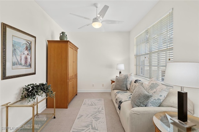 21551 Pelican Sound Dr Unit 202, Estero, FL 33928 - living area featuring light colored carpet, ceiling fan, and baseboards