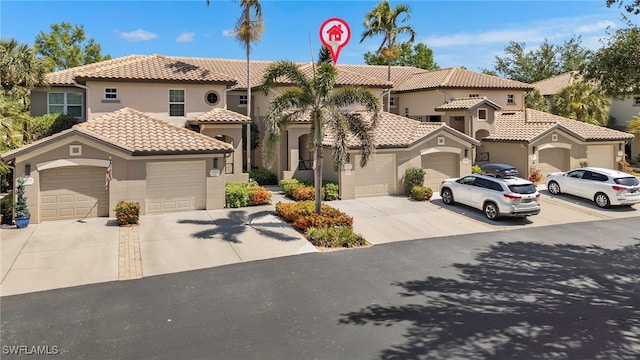21551 Pelican Sound Dr Unit 202, Estero, FL 33928 - mediterranean / spanish-style house with stucco siding, a tiled roof, and driveway