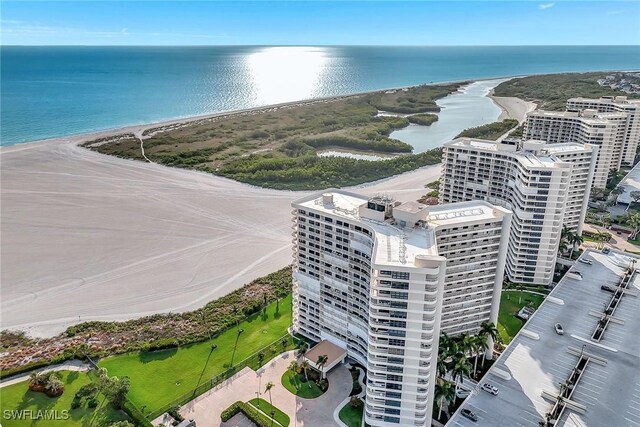 drone / aerial view of extended coastline and apartment complex