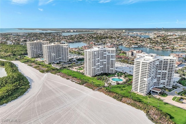 view of urban area with a large body of water and apartment complex