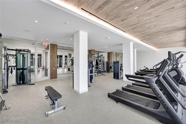 gym featuring recessed lighting, wood ceiling, and carpet floors