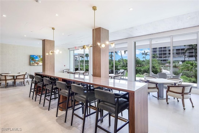 dining space featuring plenty of natural light and a chandelier