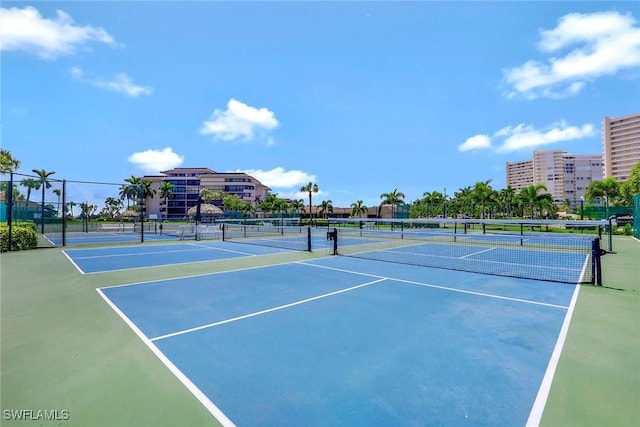 view of tennis court with fence