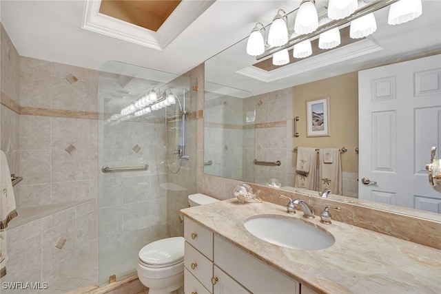 full bath featuring toilet, walk in shower, a raised ceiling, and vanity