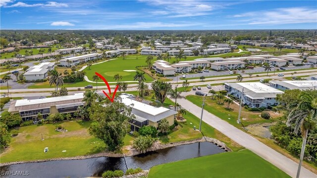 300 Palm Dr Unit 402, Naples, FL 34112 - drone / aerial view of a large body of water and a golf club