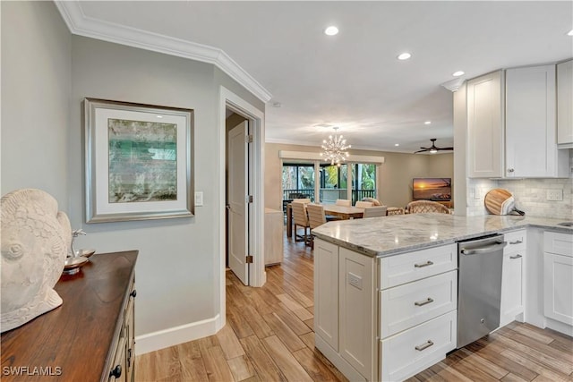 300 Palm Dr Unit 402, Naples, FL 34112 - kitchen with dishwasher, crown molding, recessed lighting, a peninsula, and decorative backsplash
