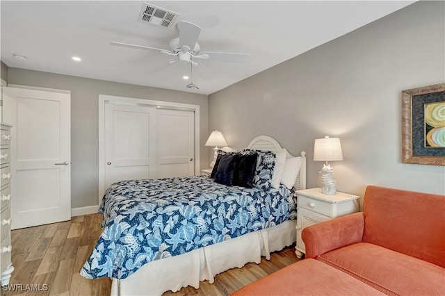 300 Palm Dr Unit 402, Naples, FL 34112 - bedroom featuring light wood-style flooring, a closet, recessed lighting, a ceiling fan, and baseboards