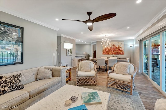 300 Palm Dr Unit 402, Naples, FL 34112 - living area featuring recessed lighting, wood finished floors, ceiling fan, crown molding, and a chandelier