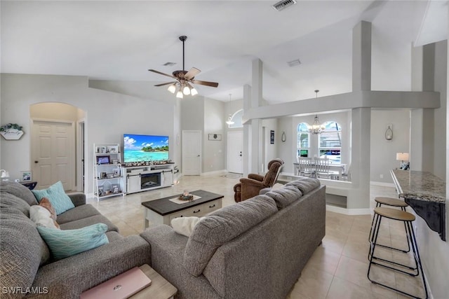 1302 SW 20th St, Cape Coral, FL 33991 - living area with arched walkways, light tile patterned flooring, a chandelier, a ceiling fan, and high vaulted ceiling