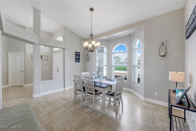 1302 SW 20th St, Cape Coral, FL 33991 - dining area with a chandelier, lofted ceiling, and baseboards