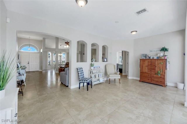 1302 SW 20th St, Cape Coral, FL 33991 - sitting room with arched walkways and a ceiling fan