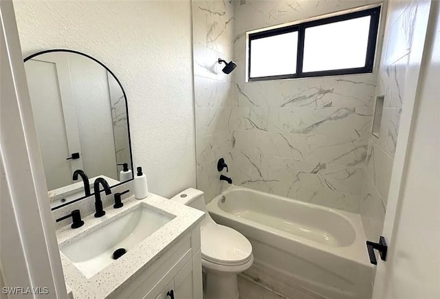 bathroom with a textured wall, toilet, shower / tub combination, and vanity