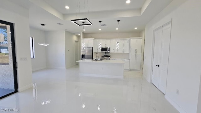 449 Redwing St, Lehigh Acres, FL 33974 - kitchen with stainless steel appliances, a tray ceiling, a sink, white cabinetry, and recessed lighting