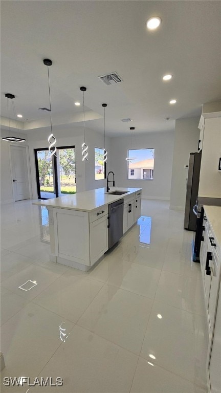 449 Redwing St, Lehigh Acres, FL 33974 - kitchen with dishwasher, freestanding refrigerator, a sink, white cabinetry, and recessed lighting