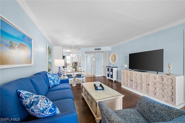190 Turtle Lake Ct Unit 311, Naples, FL 34105 - living area with crown molding, wood finished floors, and baseboards