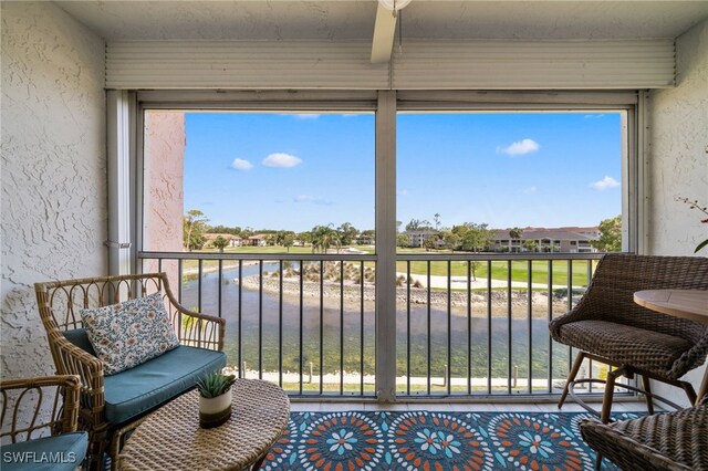 190 Turtle Lake Ct Unit 311, Naples, FL 34105 - sunroom / solarium featuring healthy amount of natural light and a residential view